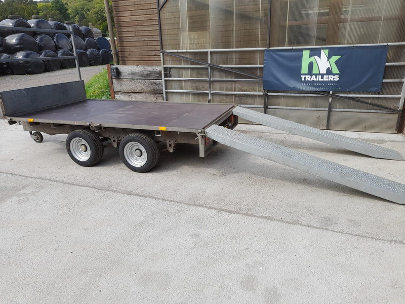 Ifor Williams LM105 10ft Flatbed Trailer for Hire, Side View with Loading Ramps