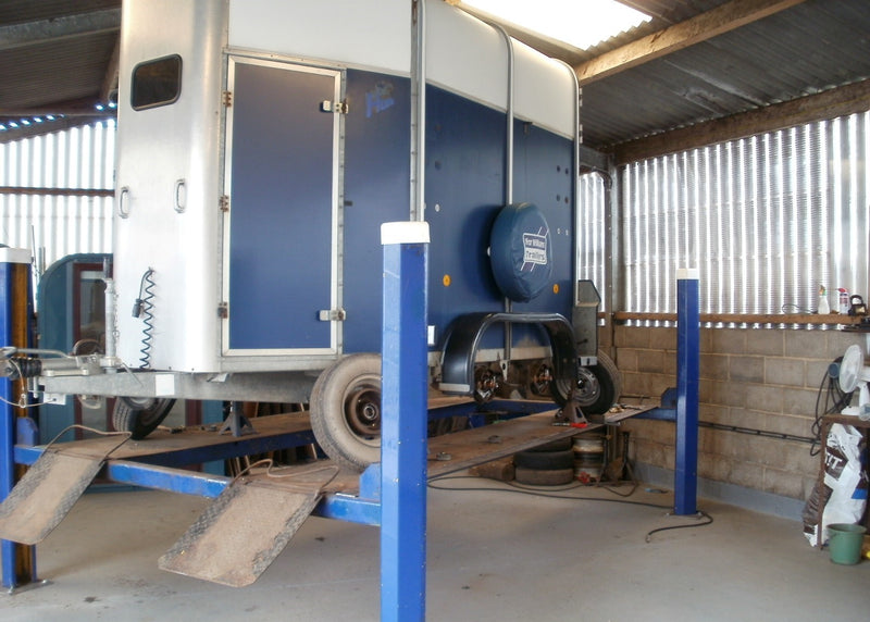 Ifor Williams horse trailer being serviced on 4 post ramp 